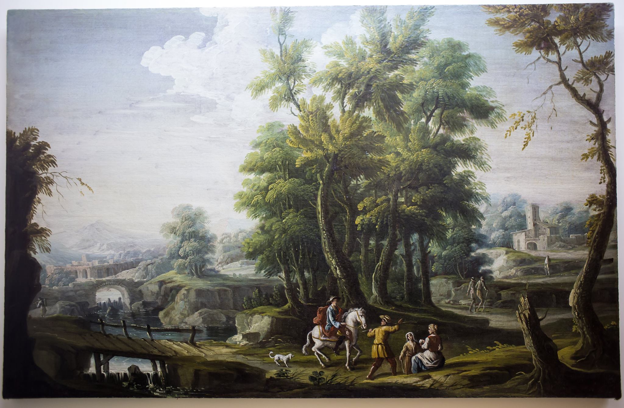 Ignoto pittore napoletano seguace di Michele Pagano,metà del XVIII secolo "Paesaggio con cavaliere e contadini" olio su tela, 95x147 cm  Sono presenti i motivi derivati dalla tradizione secentesca, dal rudere alla natura incolta alle scenette di carattere popolaresco, che inducono ad attribuire questo dipinto alla cerchia di Michele Pagano.